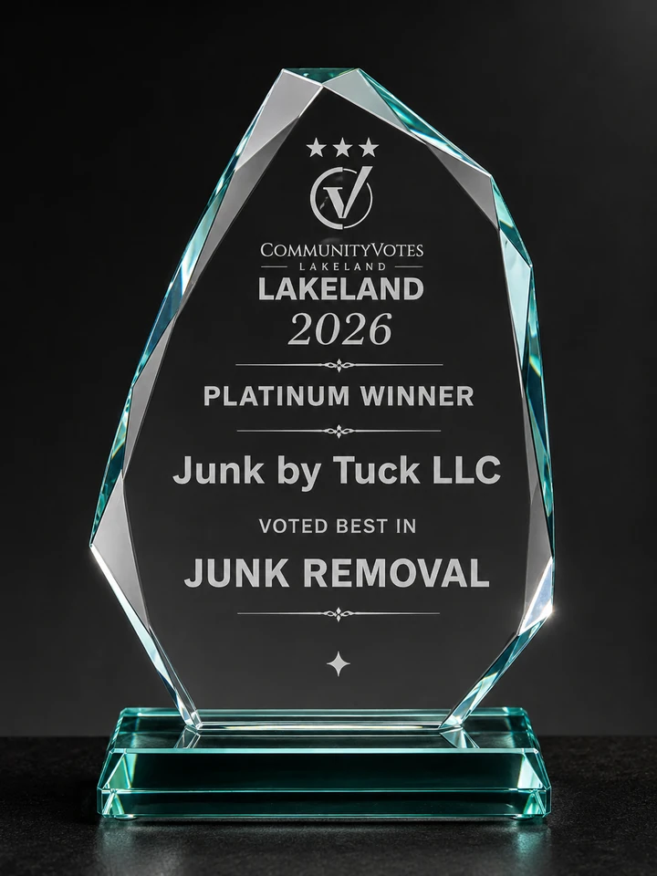 CommunityVotes Lakeland 2026 Platinum Winner trophy for Junk by Tuck LLC, voted best in Junk Removal